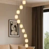 Lampadari Moderni-Selezionato da Mazzolaluce Grande lampadario a cascata per salotto moderno 9 sospensioni led cct con telecomando oro