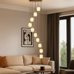 Lampadari Moderni-Selezionato da Mazzolaluce Grande lampadario a cascata per salotto moderno 9 sospensioni led cct con telecomando oro