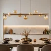 Lampadari Moderni-Selezionato da Mazzolaluce Lampadario a sospensione in legno stile nordico sfere in vetro ambra per soggiorno