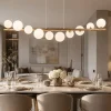 Lampadari Moderni-Selezionato da Mazzolaluce Lampadario design oro moderno sfere vetro bianco per soggiorno