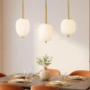 Lampadari Moderni-Selezionato da Mazzolaluce Lampadario dorato con sfere di vetro bianco per sala