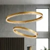Lampadari Moderni-Selezionato da Mazzolaluce Lampadario moderno anelli oro spazzolato cristalli led 3000k dimmerabile