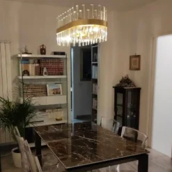 Lampadari Moderni-Selezionato da Mazzolaluce Lampadario oro ovale con cristalli per soggiorno