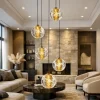 Lampadari Moderni-Selezionato da Mazzolaluce Lampadario oro 5 pendenti sfere in vetro soffiato per soggiorno