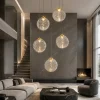 Lampadari Moderni-Selezionato da Mazzolaluce Lampadario oro sfere di vetro ondulato trasparente led 3000k dimmerabile per soggiorno