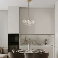 Lampadari Moderni-Selezionato da Mazzolaluce Lampadario oro sfere raggruppate trasparenti ondulate per sala da pranzo contemporanea