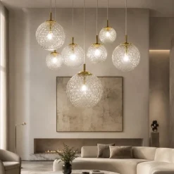 Lampadari Moderni-Selezionato da Mazzolaluce Lampadario oro sospensioni sfere di vetro trasparente rigato a grappolo per soggiorno contemporaneo