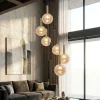 Lampadari Moderni-Selezionato da Mazzolaluce Lampadario pendenti a sospensione nero sfere vetro ambra per soggiorno