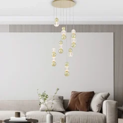 Lampadari Moderni-Selezionato da Mazzolaluce Lampadario per salotto contemporaneo sfere pendenti oro