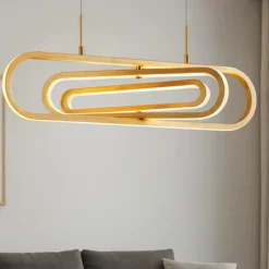Lampadari Moderni-Selezionato da Mazzolaluce Lampadario per tavolo da pranzo moderno oro orientabile led 3000k