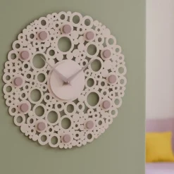 Orologi Da Parete Moderni-Selezionato da Mazzolaluce Orologio da parete legno rosa traforato rotondo