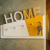 Mobili Ingresso Moderni-Selezionato da Mazzolaluce Particolare appendichiavi da parete design moderno legno colore melone