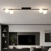 Plafoniere Moderne-Selezionato da Mazzolaluce Plafoniera moderna da soffitto barra 141 cm nera con sfere di vetro per soggiorno